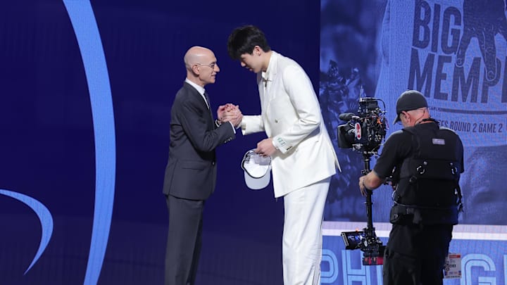 Jun 25, 2025; Brooklyn, NY, USA; Yang Hansen greets NBA commissioner Adam Silver after being selected as the 16th pick by the Memphis Grizzlies in the first round of the 2025 NBA Draft at Barclays Center. Mandatory Credit: Brad Penner-Imagn Images Jun 25, 2025; Brooklyn, NY, USA; Yang Hansen greets NBA commissioner Adam Silver after being selected as the 16th pick by the Memphis Grizzlies in the first round of the 2025 NBA Draft at Barclays Center. Mandatory Credit: Brad Penner-Imagn Images