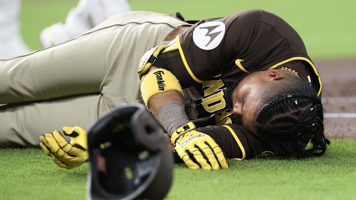 Apr 20, 2025; Houston, Texas, USA;San Diego Padres designated hitter Luis Arraez (4) lies on the field after colliding with Houston Astros first baseman Christian Walker (8) (not pictured )on the first base line in the first inning at Daikin Park. Apr 20, 2025; Houston, Texas, USA;San Diego Padres designated hitter Luis Arraez (4) lies on the field after colliding with Houston Astros first baseman Christian Walker (8) (not pictured )on the first base line in the first inning at Daikin Park.