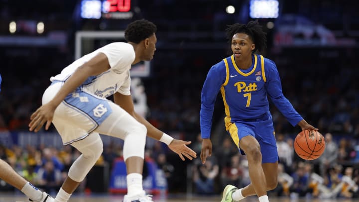 Mar 15, 2024; Washington, D.C., USA; Pittsburgh Panthers guard Carlton Carrington (7) drives to the basket as North Carolina Tar Heels forward Jalen Washington (13) defends in the first half at Capital One Arena. Mandatory Credit: Geoff Burke-USA TODAY Sports