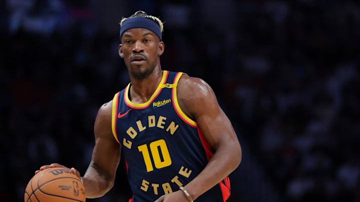 Mar 25, 2025; Miami, Florida, USA; Golden State Warriors forward Jimmy Butler III (10) dribbles the basketball against the Miami Heat during the first quarter at Kaseya Center. Mandatory Credit: Sam Navarro-Imagn Images
