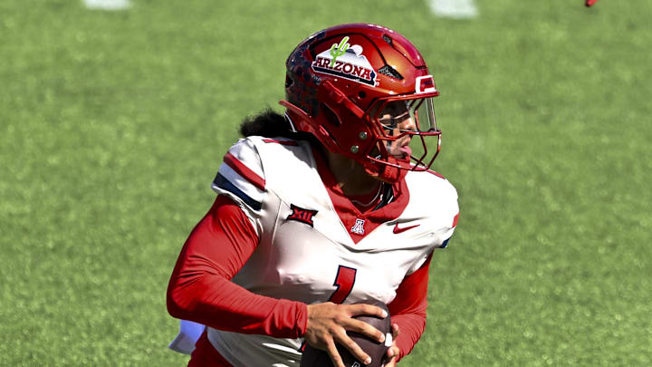 Oct 18, 2025; Houston, Texas, USA; Arizona Wildcats quarterback Noah Fifita (1) runs the ball during the first quarter against the Houston Cougars at TDECU Stadium. Mandatory Credit: Maria Lysaker-Imagn Images Oct 18, 2025; Houston, Texas, USA; Arizona Wildcats quarterback Noah Fifita (1) runs the ball during the first quarter against the Houston Cougars at TDECU Stadium. Mandatory Credit: Maria Lysaker-Imagn Images