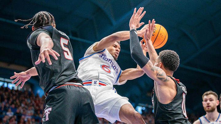 Mar 1, 2025; Lawrence, Kansas, USA; Kansas Jayhawks guard Rylan Griffen (6) battles for a rebound with with Texas Tech Red Raiders forward Darrion Williams (5) and guard Chance McMillian (0) during the second half at Allen Fieldhouse. Mandatory Credit: William Purnell-Imagn Images Mar 1, 2025; Lawrence, Kansas, USA; Kansas Jayhawks guard Rylan Griffen (6) battles for a rebound with with Texas Tech Red Raiders forward Darrion Williams (5) and guard Chance McMillian (0) during the second half at Allen Fieldhouse. Mandatory Credit: William Purnell-Imagn Images