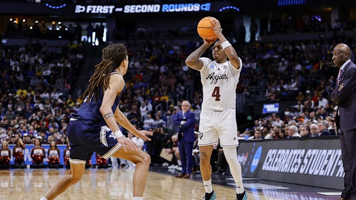 March 20, 2025; Denver, CO, USA; Texas A&M Aggies guard Wade Taylor IV (4) attempts to shoot a three point basket against the Yale Bulldogs during the first half at Ball Arena. Mandatory Credit: Isaiah J. Downing-Imagn Images