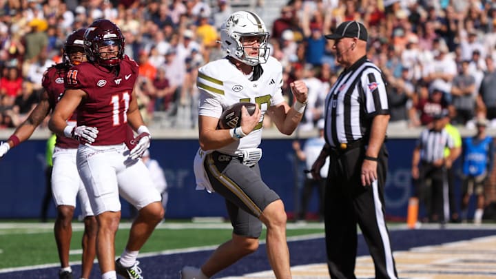 Oct 11, 2025; Atlanta, Georgia, USA; Georgia Tech Yellow Jackets quarterback Haynes King (10) scores a touchdown against the Virginia Tech Hokies in the first quarter at Bobby Dodd Stadium at Hyundai Field. Mandatory Credit: Brett Davis-Imagn Images
