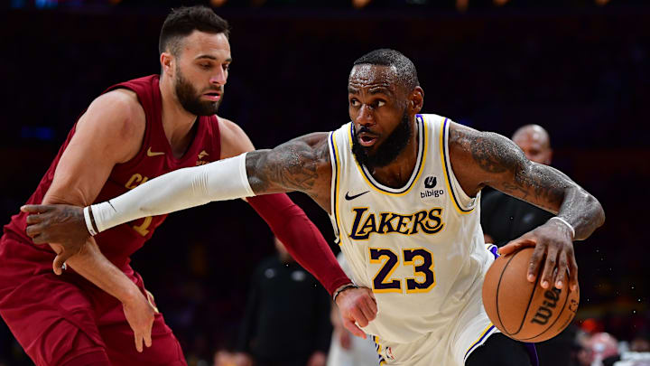 Apr 6, 2024; Los Angeles, California, USA; Los Angeles Lakers forward LeBron James (23) moves the ball against Cleveland Cavaliers guard Max Strus (1) during the second half at Crypto.com Arena. Mandatory Credit: Gary A. Vasquez-Imagn Images