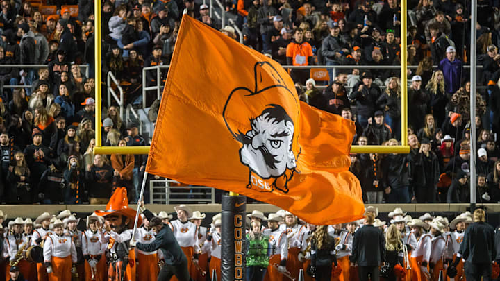 Nov 13, 2021; Stillwater, Oklahoma, USA; Oklahoma State Cowboys flag is displayed after a Cowboys touchdown during the second quarter against the TCU Horned Frogs at Boone Pickens Stadium. OSU won 63-17. Mandatory Credit: Brett Rojo-Imagn Images Nov 13, 2021; Stillwater, Oklahoma, USA; Oklahoma State Cowboys flag is displayed after a Cowboys touchdown during the second quarter against the TCU Horned Frogs at Boone Pickens Stadium. OSU won 63-17. Mandatory Credit: Brett Rojo-Imagn Images