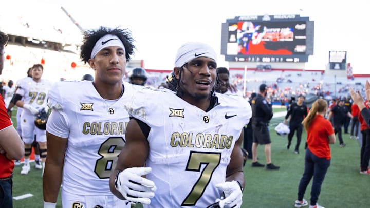 Oct 19, 2024; Tucson, Arizona, USA; Colorado Buffaloes running back Dallan Hayden (7) and quarterback Destin Wade (8) against the Arizona Wildcats at Arizona Stadium. Mandatory Credit: Mark J. Rebilas-Imagn Images