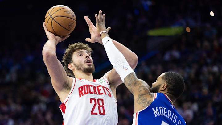 Jan 15, 2024; Philadelphia, Pennsylvania, USA; Houston Rockets center Alperen Sengun (28) shoots the ball against Philadelphia 76ers forward Marcus Morris Sr. (5) during the third quarter at Wells Fargo Center. Mandatory Credit: Bill Streicher-Imagn Images