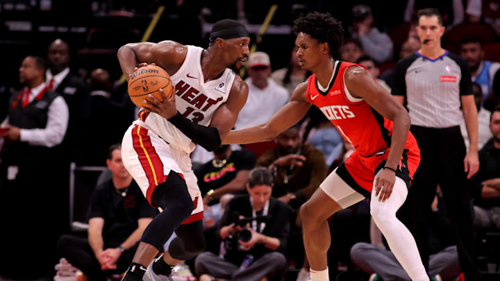 Dec 29, 2024; Houston, Texas, USA; Miami Heat guard Dru Smith (12) handles the ball against Houston Rockets guard Amen Thompson (1) during the second quarter at Toyota Center. Mandatory Credit: Erik Williams-Imagn Images
Dec 29, 2024; Houston, Texas, USA; Miami Heat guard Dru Smith (12) handles the ball against Houston Rockets guard Amen Thompson (1) during the second quarter at Toyota Center. Mandatory Credit: Erik Williams-Imagn Images