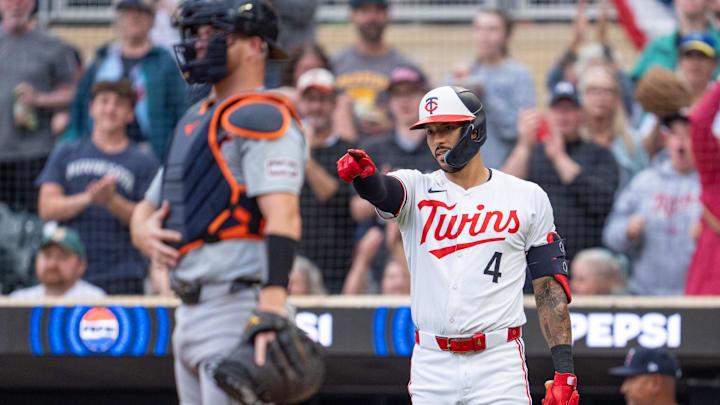 Jul 2, 2024; Minneapolis, Minnesota, USA; Minnesota Twins shortstop Carlos Correa (4) points to right fielder Manuel Margot (13) as he crosses home plate after hitting a solo home run against the Detroit Tigers in the fifth inning at Target Field. Mandatory Credit: Matt Blewett-Imagn Images Jul 2, 2024; Minneapolis, Minnesota, USA; Minnesota Twins shortstop Carlos Correa (4) points to right fielder Manuel Margot (13) as he crosses home plate after hitting a solo home run against the Detroit Tigers in the fifth inning at Target Field. Mandatory Credit: Matt Blewett-Imagn Images