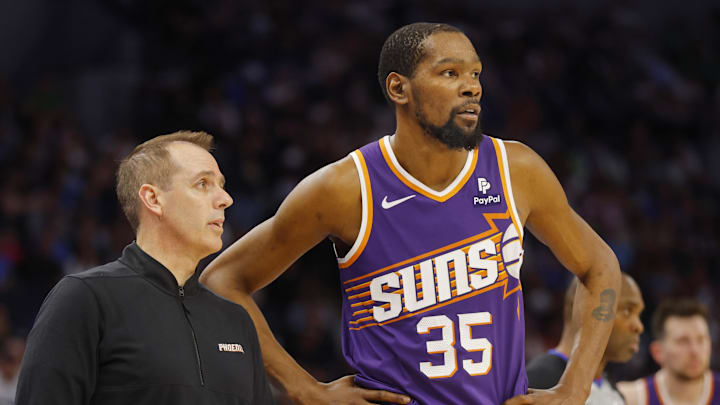 Apr 14, 2024; Minneapolis, Minnesota, USA; Phoenix Suns head coach Frank Vogel speaks with forward