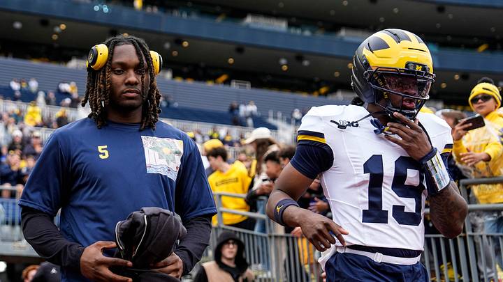 Michigan safety Jacob Oden, left, and quarterback Bryce Underwood (19) take the field for the spring game at Michigan Stadium in Ann Arbor on Saturday, April 18, 2026.