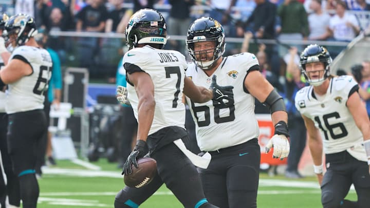 Oct 8, 2023; London, United Kingdom; Jacksonville Jaguars wide receiver Zay Jones (7) celebrates with guard Brandon Scherff (68) and quarterback Trevor Lawrence (16) after he scored a touchdown during the first half of an NFL International Series game at Tottenham Hotspur Stadium. Mandatory Credit: Peter van den Berg-Imagn Images Oct 8, 2023; London, United Kingdom; Jacksonville Jaguars wide receiver Zay Jones (7) celebrates with guard Brandon Scherff (68) and quarterback Trevor Lawrence (16) after he scored a touchdown during the first half of an NFL International Series game at Tottenham Hotspur Stadium. Mandatory Credit: Peter van den Berg-Imagn Images