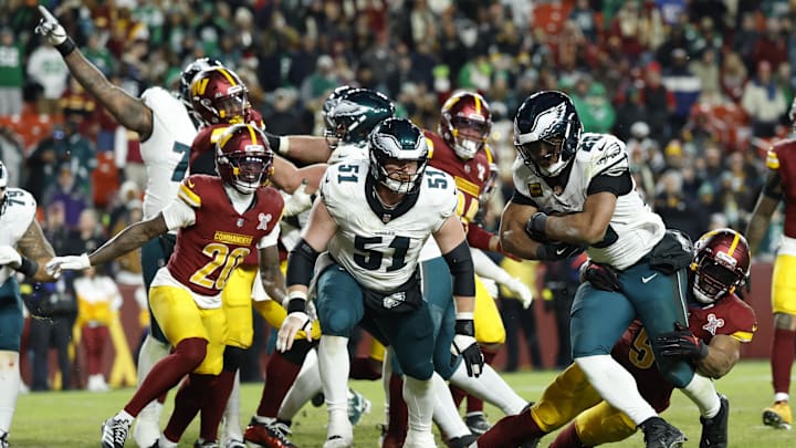 Dec 20, 2025; Landover, Maryland, USA; Philadelphia Eagles running back Saquon Barkley (26) scores on a two-point conversion as Washington Commanders linebacker Bobby Wagner (54) attempts the tackle in the fourth quarter at Northwest Stadium. Mandatory Credit: Geoff Burke-Imagn Images
