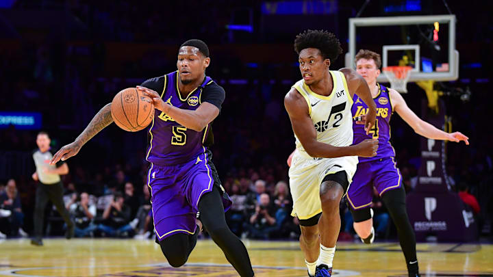 Nov 19, 2024; Los Angeles, California, USA; Los Angeles Lakers forward Cam Reddish (5) moves the ball ahead of Utah Jazz guard Collin Sexton (2) during the first half at Crypto.com Arena. Mandatory Credit: Gary A. Vasquez-Imagn Images
