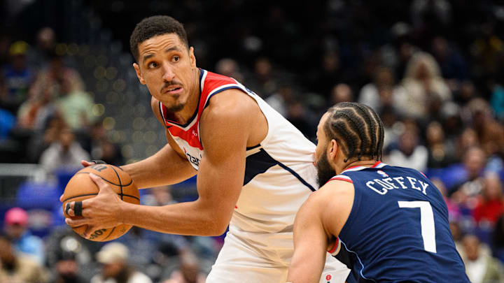 Nov 27, 2024; Washington, District of Columbia, USA; Washington Wizards guard Malcolm Brogdon (15) handles the ball against LA Clippers guard Amir Coffey (7) during the first quarter against the LA Clippers at Capital One Arena. Mandatory Credit: Reggie Hildred-Imagn Images