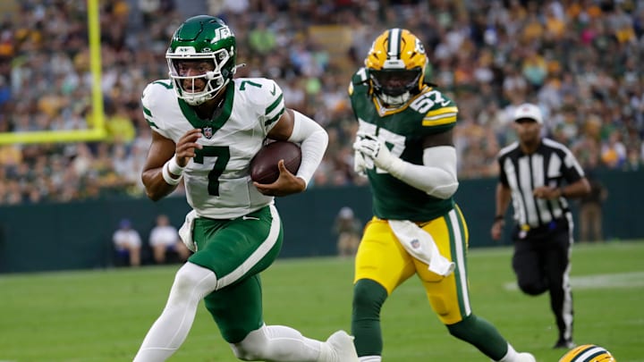 New York Jets quarterback Justin Fields (7) breaks away for a touchdown run against Green Bay Packers cornerback Keisean Nixon (25) during their football game Saturday, August 9, 2025, at Lambeau Field in Green Bay, Wisconsin.