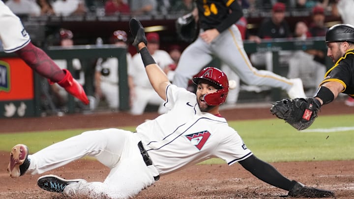 Arizona Diamondbacks player Jordan Lawlar (10) slides in safely at home plate to score a run against the Pittsburgh Pirates at Chase Field in Phoenix on May 27, 2025. Arizona Diamondbacks player Jordan Lawlar (10) slides in safely at home plate to score a run against the Pittsburgh Pirates at Chase Field in Phoenix on May 27, 2025.