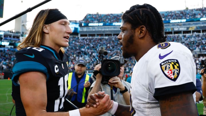 Nov 27, 2022; Jacksonville, Florida, USA; Jacksonville Jaguars quarterback Trevor Lawrence (16) and Baltimore Ravens quarterback Lamar Jackson (8) shake hands after the game at TIAA Bank Field. Mandatory Credit: Douglas DeFelice-USA TODAY Sports