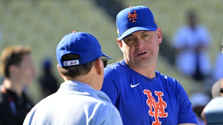 Oct 13, 2024; Los Angeles, California, USA; New York Mets manager Carlos Mendoza (64) talks with owner Steve Cohen before game one of the NLCS for the 2024 MLB Playoffs at Dodger Stadium. Mandatory Credit: Jayne Kamin-Oncea-Imagn Images