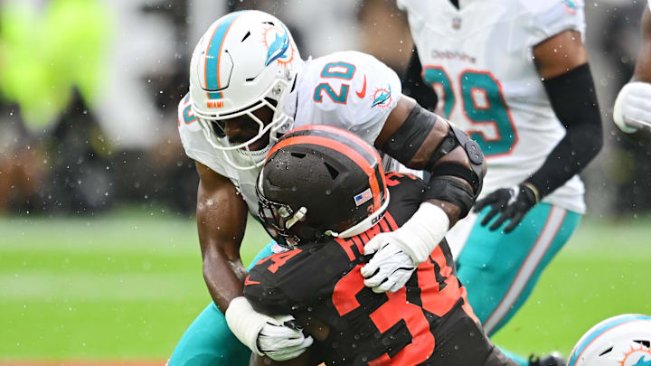 Miami Dolphins linebacker Jordyn Brooks (20) tackles Cleveland Browns running back Jerome Ford (34) during the first quarter at Huntington Bank Field. Miami Dolphins linebacker Jordyn Brooks (20) tackles Cleveland Browns running back Jerome Ford (34) during the first quarter at Huntington Bank Field.