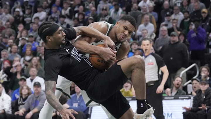 Jan 2, 2025; Milwaukee, Wisconsin, USA; Milwaukee Bucks forward Giannis Antetokounmpo (34) and Brooklyn Nets guard Keon Johnson (45) battle for a rebound in the second half at Fiserv Forum. Mandatory Credit: Michael McLoone-Imagn Images Jan 2, 2025; Milwaukee, Wisconsin, USA; Milwaukee Bucks forward Giannis Antetokounmpo (34) and Brooklyn Nets guard Keon Johnson (45) battle for a rebound in the second half at Fiserv Forum. Mandatory Credit: Michael McLoone-Imagn Images