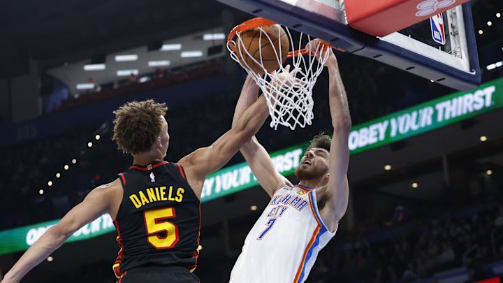 Oct 27, 2024; Oklahoma City, Oklahoma, USA; Oklahoma City Thunder forward Chet Holmgren (7) dunks in front of Atlanta Hawks guard Dyson Daniels (5) during the second half at Paycom Center. Mandatory Credit: Alonzo Adams-Imagn Images Oct 27, 2024; Oklahoma City, Oklahoma, USA; Oklahoma City Thunder forward Chet Holmgren (7) dunks in front of Atlanta Hawks guard Dyson Daniels (5) during the second half at Paycom Center. Mandatory Credit: Alonzo Adams-Imagn Images