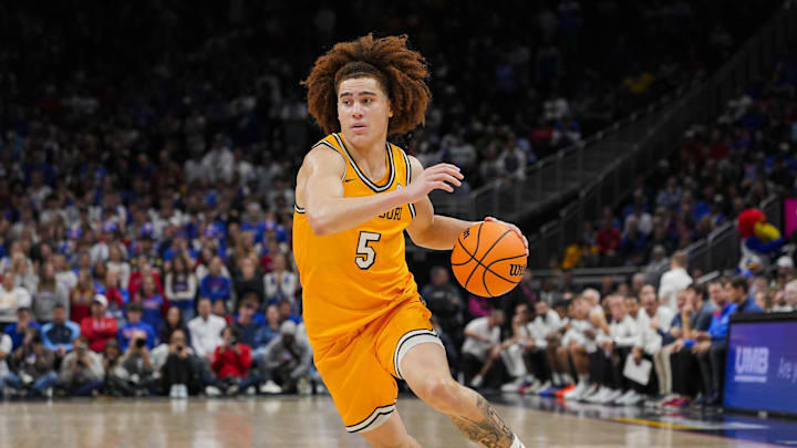 Dec 7, 2025; Kansas City, Missouri, USA; Missouri Tigers guard T.O. Barrett (5) dribbles the ball during the second half against the Kansas Jayhawks at T-Mobile Center. Mandatory Credit: Jay Biggerstaff-Imagn Images