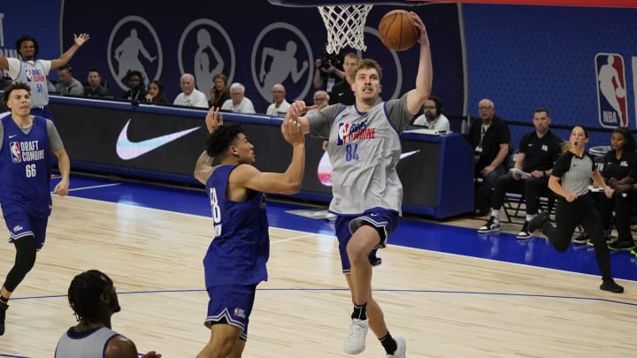 May 14, 2024; Chicago, IL, USA; Baylor Scheierman (84) scores over KJ Simpson (58) during the 2024 NBA Draft Combine  at Wintrust Arena. Mandatory Credit: David Banks-USA TODAY Sports