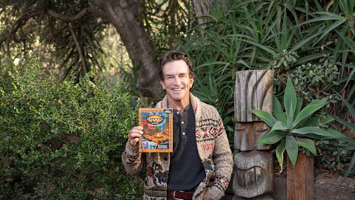 Jeff Probst with the Survivor: The Tribe Has Spoken card game - Credit: Exploding Kittens 