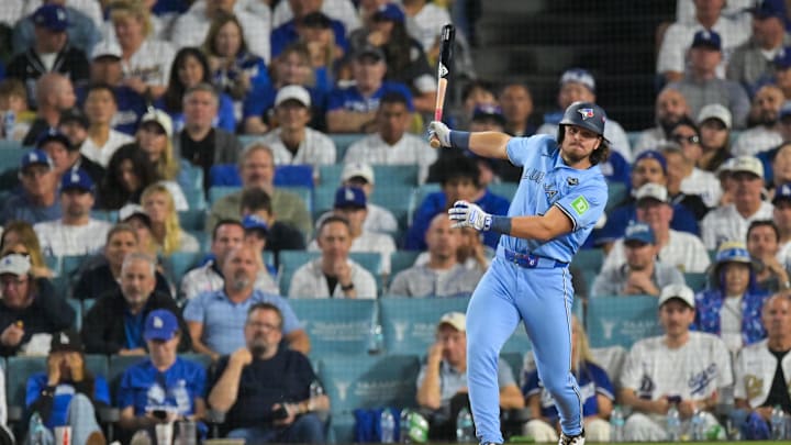 Oct 28, 2025; Los Angeles, California, USA; Toronto Blue Jays right fielder Addison Barger (47) hits an RBI single during the seventh inning against the Los Angeles Dodgers during game four of the 2025 MLB World Series at Dodger Stadium. Mandatory Credit: Jayne Kamin-Oncea-Imagn Images Oct 28, 2025; Los Angeles, California, USA; Toronto Blue Jays right fielder Addison Barger (47) hits an RBI single during the seventh inning against the Los Angeles Dodgers during game four of the 2025 MLB World Series at Dodger Stadium. Mandatory Credit: Jayne Kamin-Oncea-Imagn Images