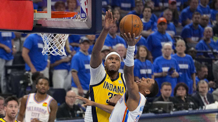 Jun 16, 2025; Oklahoma City, Oklahoma, USA; Oklahoma City Thunder guard Aaron Wiggins (21) drives to the basket past Indiana Pacers center Myles Turner (33) during the second quarter in game five of the 2025 NBA Finals at Paycom Center. Mandatory Credit: Kyle Terada-Imagn Images Jun 16, 2025; Oklahoma City, Oklahoma, USA; Oklahoma City Thunder guard Aaron Wiggins (21) drives to the basket past Indiana Pacers center Myles Turner (33) during the second quarter in game five of the 2025 NBA Finals at Paycom Center. Mandatory Credit: Kyle Terada-Imagn Images