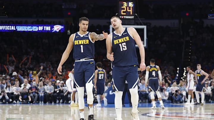 Mar 10, 2025; Oklahoma City, Oklahoma, USA; Denver Nuggets forward Michael Porter Jr. (1) and center Nikola Jokic (15) talk during a time out against the Oklahoma City Thunder during the second half at Paycom Center. Mandatory Credit: Alonzo Adams-Imagn Images Mar 10, 2025; Oklahoma City, Oklahoma, USA; Denver Nuggets forward Michael Porter Jr. (1) and center Nikola Jokic (15) talk during a time out against the Oklahoma City Thunder during the second half at Paycom Center. Mandatory Credit: Alonzo Adams-Imagn Images