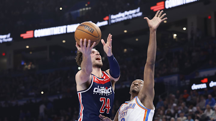 Feb 23, 2024; Oklahoma City, Oklahoma, USA; Washington Wizards forward Corey Kispert (24) shoots as Oklahoma City Thunder forward Jalen Williams (8) defends during the second quarter at Paycom Center. Mandatory Credit: Alonzo Adams-Imagn Images