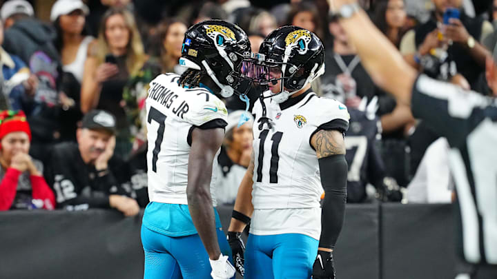 Dec 22, 2024; Paradise, Nevada, USA; Jacksonville Jaguars wide receiver Brian Thomas Jr. (7) celebrates with wide receiver Parker Washington (11) after scoring a touchdown against the Las Vegas Raiders during the third quarter at Allegiant Stadium. Mandatory Credit: Stephen R. Sylvanie-Imagn Images Dec 22, 2024; Paradise, Nevada, USA; Jacksonville Jaguars wide receiver Brian Thomas Jr. (7) celebrates with wide receiver Parker Washington (11) after scoring a touchdown against the Las Vegas Raiders during the third quarter at Allegiant Stadium. Mandatory Credit: Stephen R. Sylvanie-Imagn Images
