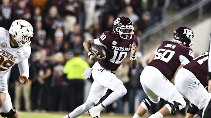 Nov 30, 2024; College Station, Texas, USA; Texas A&M Aggies quarterback Marcel Reed (10) runs the ball during the first quarter against the Texas Longhorns.The Longhorns defeated the Aggies 17-7 at Kyle Field. Mandatory Credit: Maria Lysaker-Imagn Images  