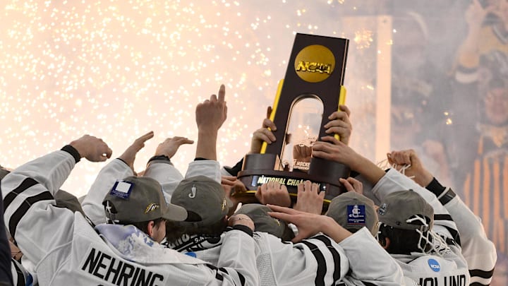 Apr 12, 2025; St. Louis, Missouri — Western Michigan Broncos hoist the national championship trophy after defeating the Boston University Terriers to win the Frozen Four college ice hockey national championship at Enterprise Center. 