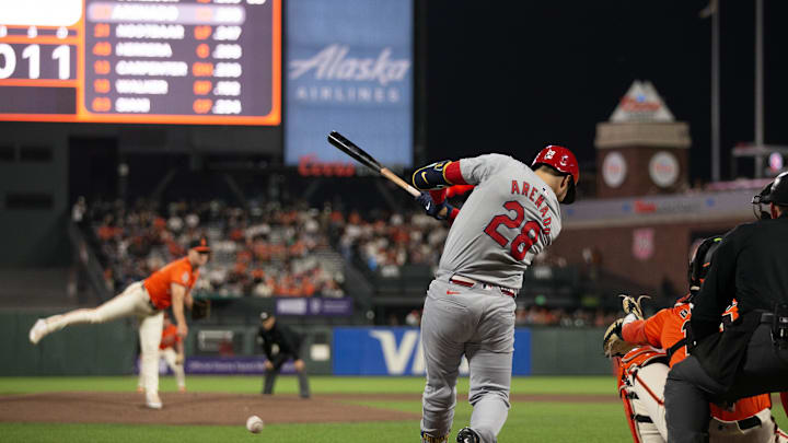 St. Louis Cardinals third baseman Nolan Arenado (28) hits an RBI single off San Francisco Giants starting pitcher Landen Roupp (65) during the first inning at Oracle Park in 2024.