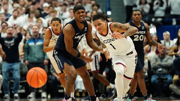 Dec 18, 2024; Storrs, Connecticut, USA; Xavier Musketeers guard Ryan Conwell (7) called for a foul against UConn Huskies guard Solo Ball (1) in overtime at Harry A. Gampel Pavilion. Mandatory Credit: David Butler II-Imagn Images Dec 18, 2024; Storrs, Connecticut, USA; Xavier Musketeers guard Ryan Conwell (7) called for a foul against UConn Huskies guard Solo Ball (1) in overtime at Harry A. Gampel Pavilion. Mandatory Credit: David Butler II-Imagn Images