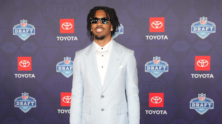 Apr 25, 2024; Detroit, MI, USA; LSU Tigers quarterback Jayden Daniels stands on the red carpet ahead
