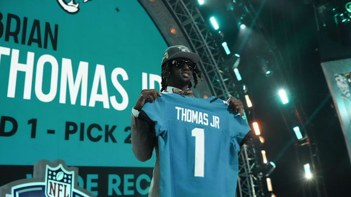 Apr 25, 2024; Detroit, MI, USA; LSU Tigers wide receiver Brian Thomas Jr. poses after being selected by the Jacksonville Jaguars as the No. 23 pick during the first round of the 2024 NFL Draft at Campus Martius Park and Hart Plaza. Mandatory Credit: Kirby Lee-Imagn Images