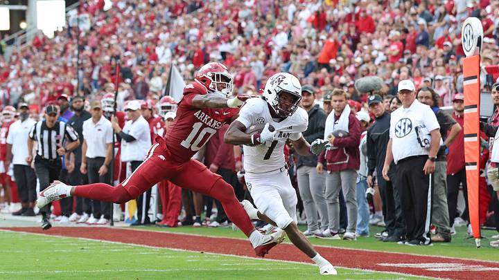 Texas A&M Aggies wide receiver Izaiah Williams (1) is pushed out of bounds near the goal line in the second quarter by Arkansas Razorbacks linebacker Xavian Sorey Jr (10) at Donald W. Reynolds Razorback Stadium. Texas A&M Aggies wide receiver Izaiah Williams (1) is pushed out of bounds near the goal line in the second quarter by Arkansas Razorbacks linebacker Xavian Sorey Jr (10) at Donald W. Reynolds Razorback Stadium.