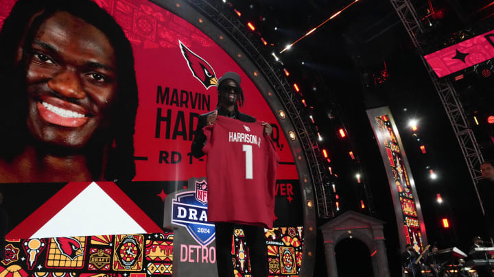 Apr 25, 2024; Detroit, MI, USA; Ohio State Buckeyes wide receiver Marvin Harrison Jr. poses after being selected by the Arizona Cardinals as the No. 4 pick in the first round of the 2024 NFL Draft at Campus Martius Park and Hart Plaza. Mandatory Credit: Kirby Lee-USA TODAY Sports Apr 25, 2024; Detroit, MI, USA; Ohio State Buckeyes wide receiver Marvin Harrison Jr. poses after being selected by the Arizona Cardinals as the No. 4 pick in the first round of the 2024 NFL Draft at Campus Martius Park and Hart Plaza. Mandatory Credit: Kirby Lee-USA TODAY Sports