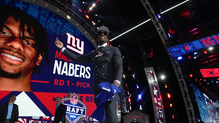 Apr 25, 2024; Detroit, MI, USA; Wide receiver Malik Nabers reacts after being selected by the New York Giants as the No. 6 pick in the first round of the 2024 NFL Draft. Apr 25, 2024; Detroit, MI, USA; Wide receiver Malik Nabers reacts after being selected by the New York Giants as the No. 6 pick in the first round of the 2024 NFL Draft.