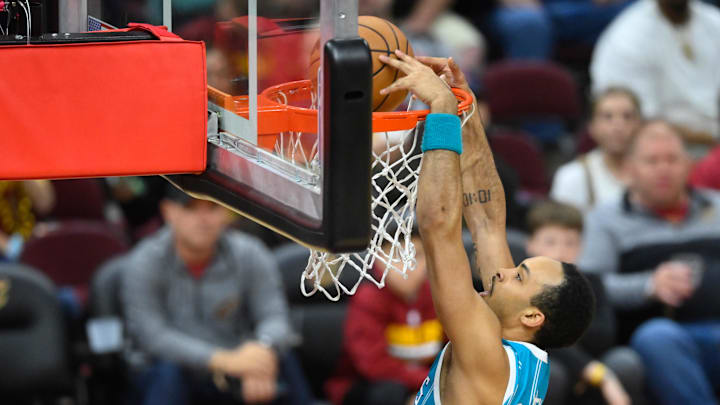 Apr 14, 2024; Cleveland, Ohio, USA; Charlotte Hornets guard Amari Bailey (10) dunks in the fourth quarter against the Cleveland Cavaliers at Rocket Mortgage FieldHouse. Mandatory Credit: David Richard-Imagn Images