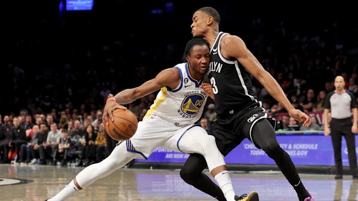 Dec 21, 2022; Brooklyn, New York, USA; Golden State Warriors forward Jonathan Kuminga (00) tries to go around Brooklyn Nets center Nic Claxton (33) during the second quarter at Barclays Center. Mandatory Credit: Brad Penner-Imagn Images Dec 21, 2022; Brooklyn, New York, USA; Golden State Warriors forward Jonathan Kuminga (00) tries to go around Brooklyn Nets center Nic Claxton (33) during the second quarter at Barclays Center. Mandatory Credit: Brad Penner-Imagn Images