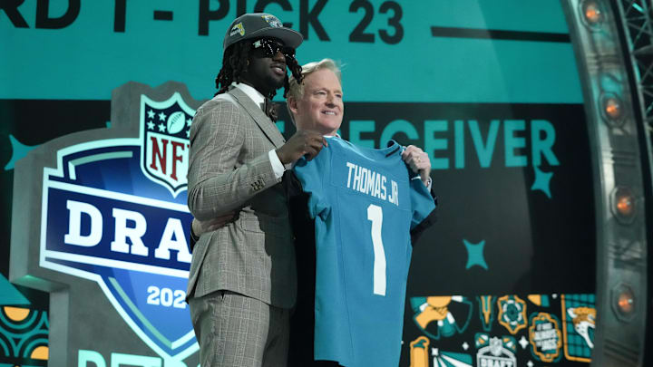 Apr 25, 2024; Detroit, MI, USA; LSU Tigers wide receiver Brian Thomas Jr. poses with NFL commissioner Roger Goodell after being selected by the Jacksonville Jaguars as the No. 23 pick during the first round of the 2024 NFL Draft at Campus Martius Park and Hart Plaza. Mandatory Credit: Kirby Lee-Imagn Images