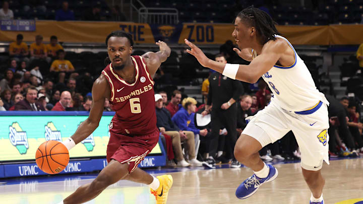 Mar 4, 2026; Pittsburgh, Pennsylvania, USA;  Florida State Seminoles guard Robert McCray V. (6) drives to the basket against Pittsburgh Panthers guard Omari Witherspoon (8) during the first half at the Petersen Events Center. Mandatory Credit: Charles LeClaire-Imagn Images