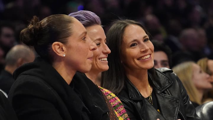 Feb 16, 2020; Chicago, Illinois, USA; From left Diana Taurasi , Megan Rapinoe and Sue Bird in attendance during the third quarter of the 2020 NBA All Star Game at United Center. Mandatory Credit: Kyle Terada-Imagn Images