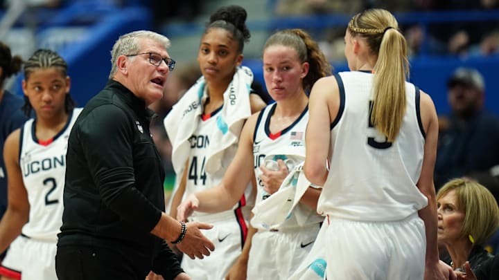 Nov 8, 2023; Hartford, Connecticut, USA; UConn Huskies head coach Geno Auriemma talks with guard Paige Bueckers (5) as she comes off the court against the Dayton Flyers at XL Center. Mandatory Credit: David Butler II-Imagn Images Nov 8, 2023; Hartford, Connecticut, USA; UConn Huskies head coach Geno Auriemma talks with guard Paige Bueckers (5) as she comes off the court against the Dayton Flyers at XL Center. Mandatory Credit: David Butler II-Imagn Images